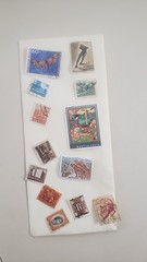 misclineous stamps from different regions of the world and 22kt gold replicas