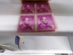 24 4 CENT PURPLE LINCOLN STAMPS MNH IN THE ORIGINAL BOOK