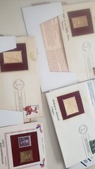 misclineous stamps from different regions of the world and 22kt gold replicas