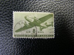 7105) One: 8¢ US Air Mail Postage Stamp 1944 Airplane Olive
