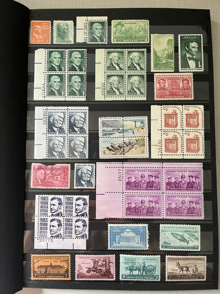 Various US mint stamps with a 16-page stamp album in excellent condition