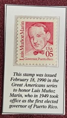 An uncirculated postage stamp sealed in plastic.