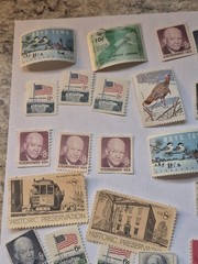 50 Mint condition US postage stamps. Various denominations 1940s,1950s,1960s