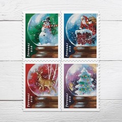 USPS Snow Globes Forever Postage Stamps (A Snowman, Santa Claus Poised on a…