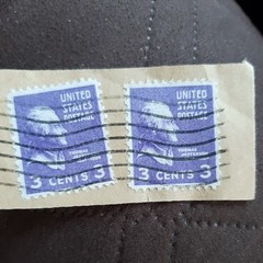 Two 3 cent Thomas Jefferson stamps purple